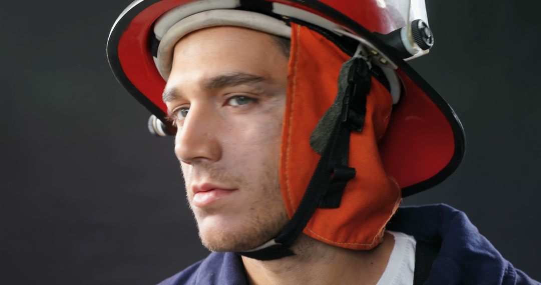 Confident Firefighter in Helmet Close-Up Profile View - Free Images, Stock Photos and Pictures on Pikwizard.com