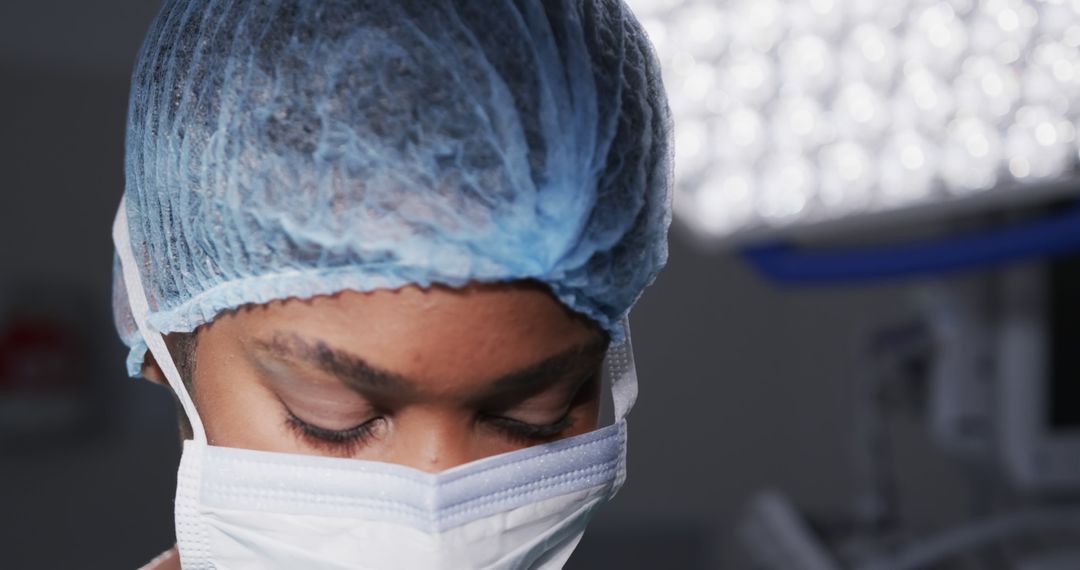 Surgeon in Operating Room Wearing Protective Mask and Hair Cover - Free Images, Stock Photos and Pictures on Pikwizard.com