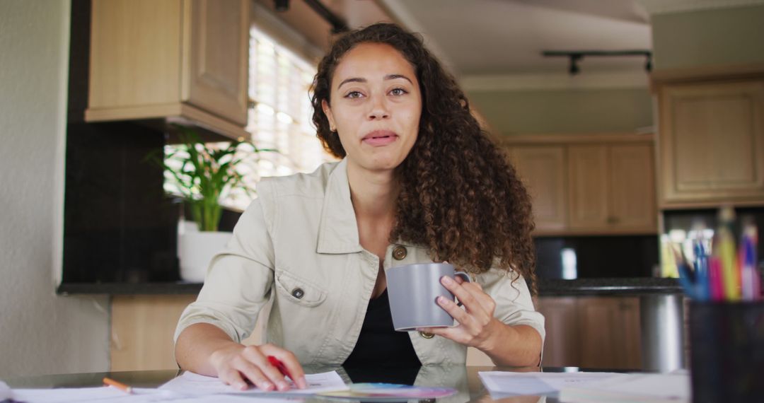 Smiling Woman Video Calling with Coffee in Kitchen
