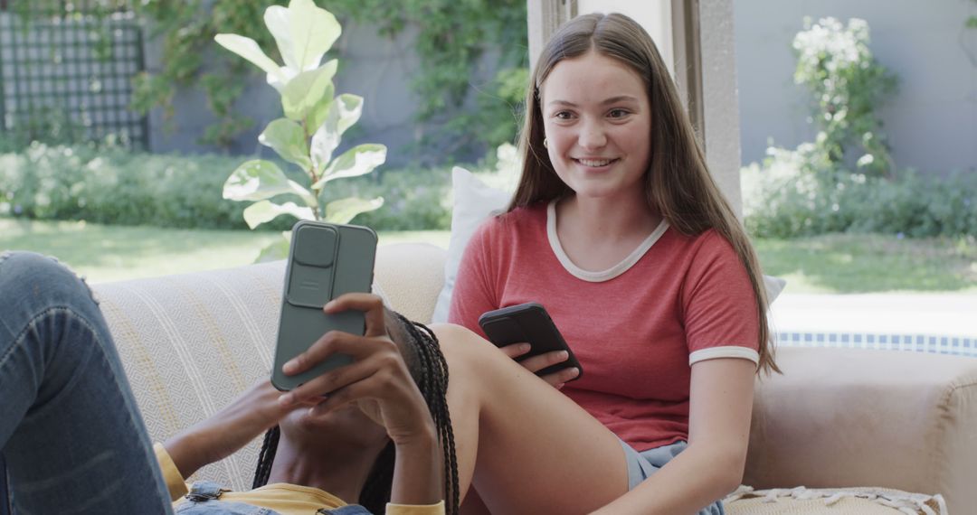 Teenage Friends Relaxing and Using Smartphones at Home - Free Images, Stock Photos and Pictures on Pikwizard.com