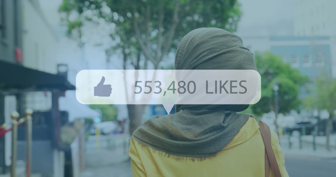 Woman in Hijab Using Social Media Augmented Reality in City