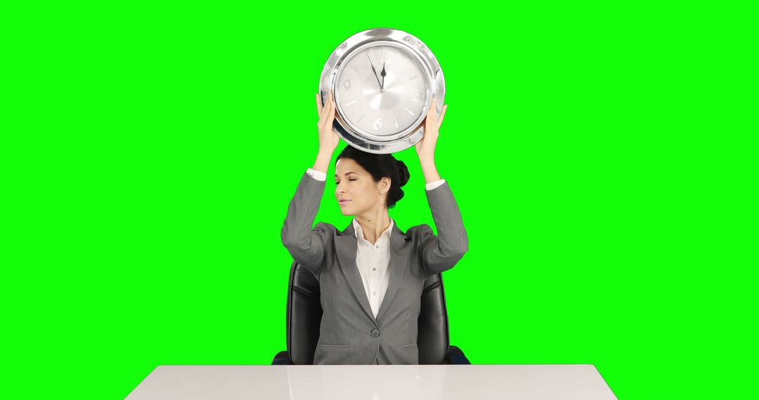 Businesswoman Holding Clock Overhead in Office Bright Green Background - Free Images, Stock Photos and Pictures on Pikwizard.com