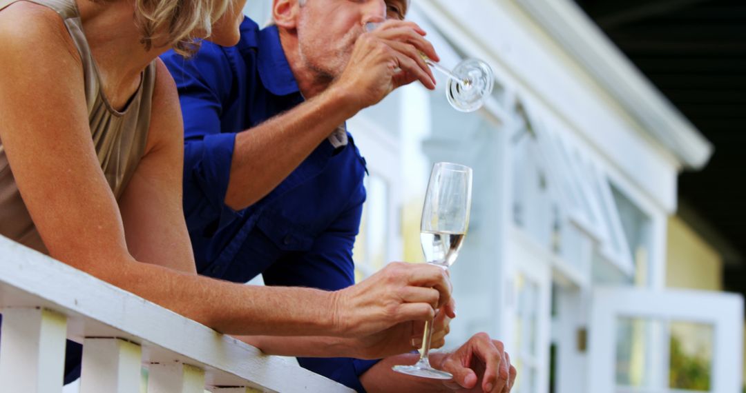 Couple Relaxing and Drinking Wine on Porch - Free Images, Stock Photos and Pictures on Pikwizard.com