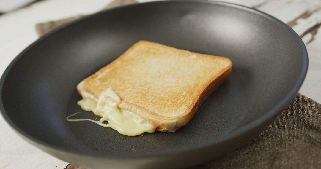 Image of freshly toasted cheese white bread sandwich prepared on frying pan - Free Images, Stock Photos and Pictures on Pikwizard.com