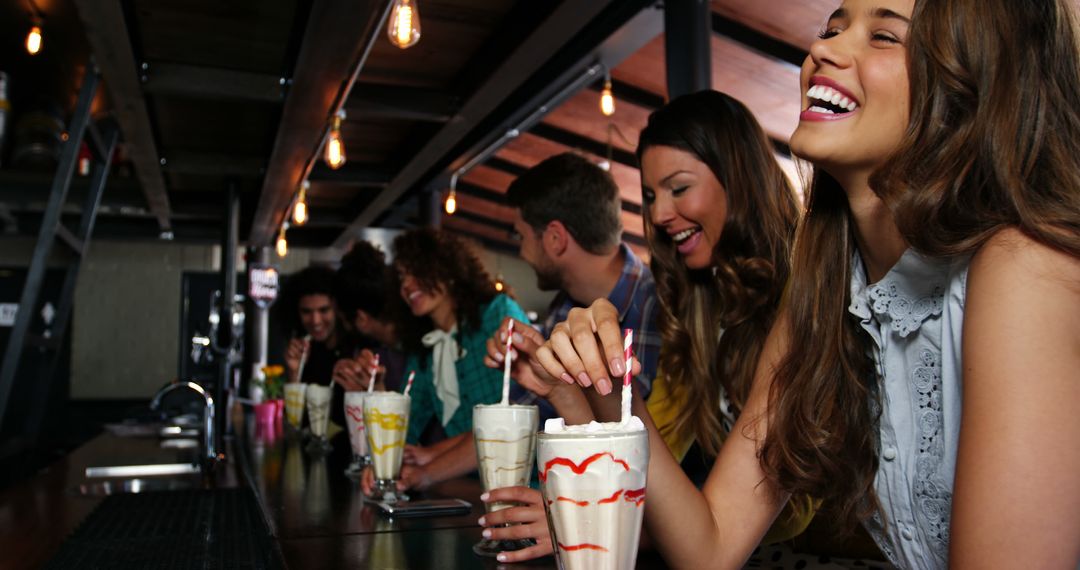 Group of Friends Enjoying Milkshakes at Modern Cafe - Free Images, Stock Photos and Pictures on Pikwizard.com