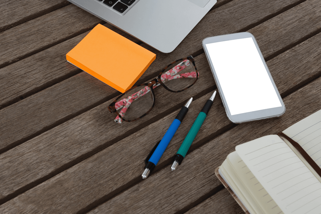 Wooden Desk with Office Supplies and Transparent Phone Screen