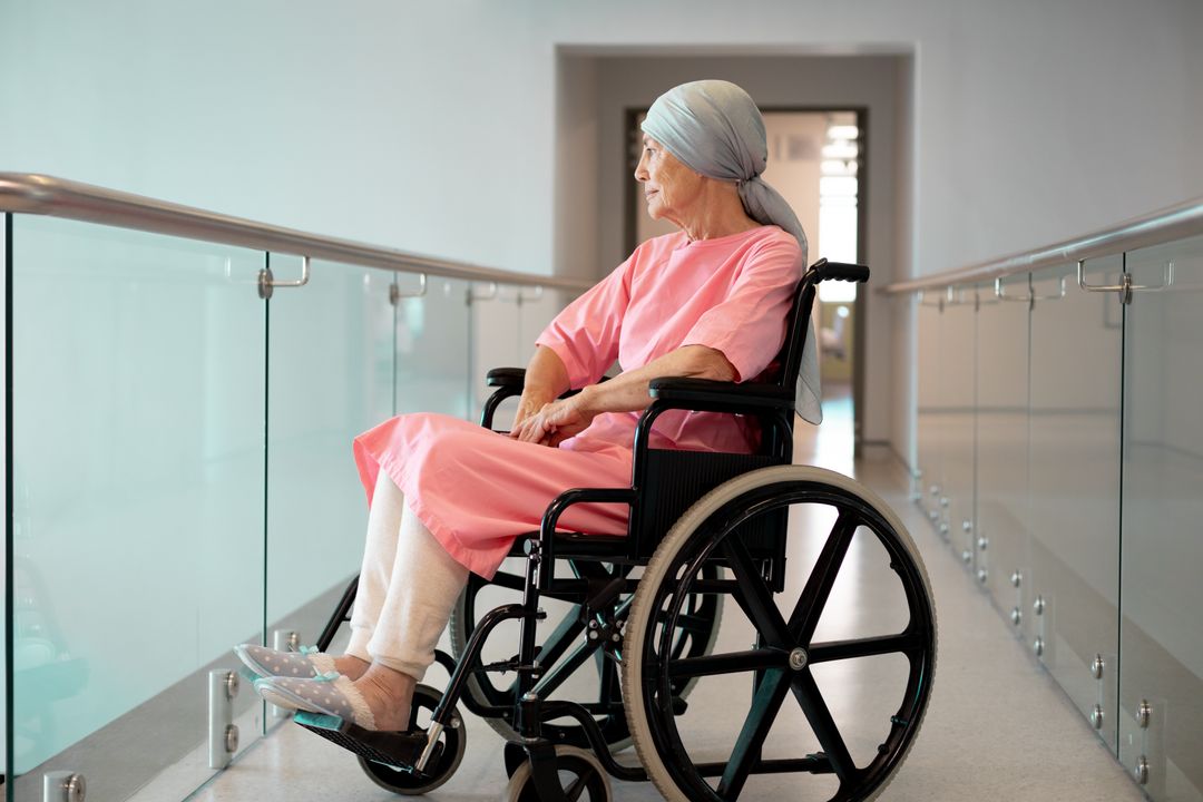 Happy senior caucasian female patient in wheelchair sitting in hospital corridor smiling - Free Images, Stock Photos and Pictures on Pikwizard.com