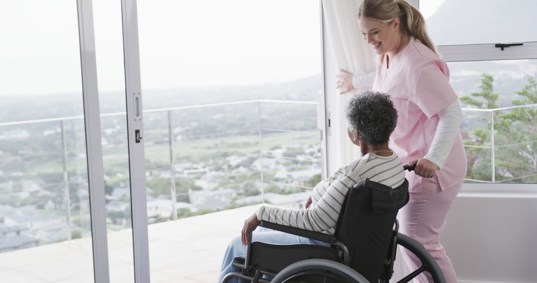 Nurse assisting elderly woman in wheelchair by sunny window - Free Images, Stock Photos and Pictures on Pikwizard.com