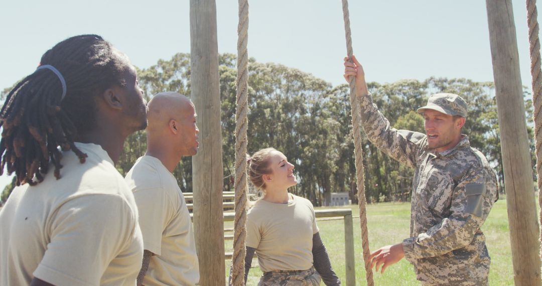 Diverse Soldiers Learning Rope Climb with Tactical Trainer