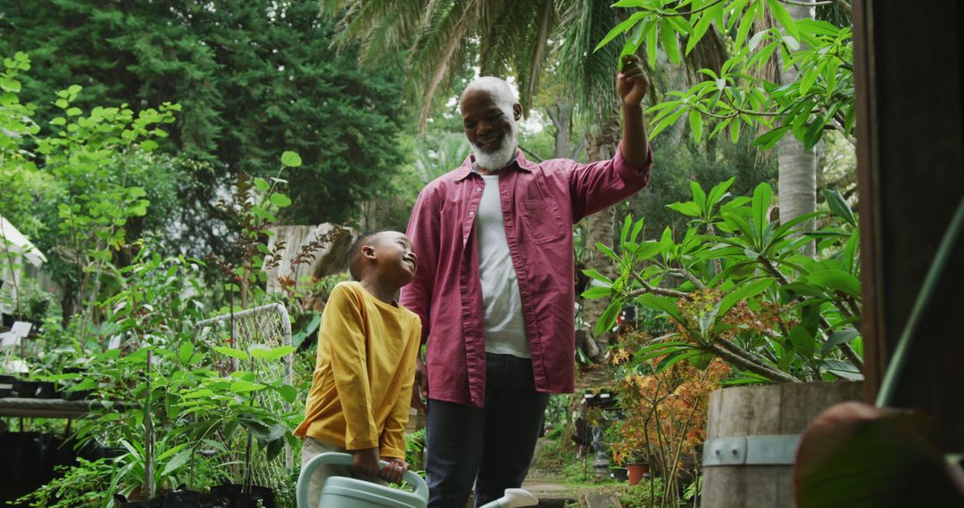 Grandfather and Grandchild Gardening Together in Lush Garden - Free Images, Stock Photos and Pictures on Pikwizard.com