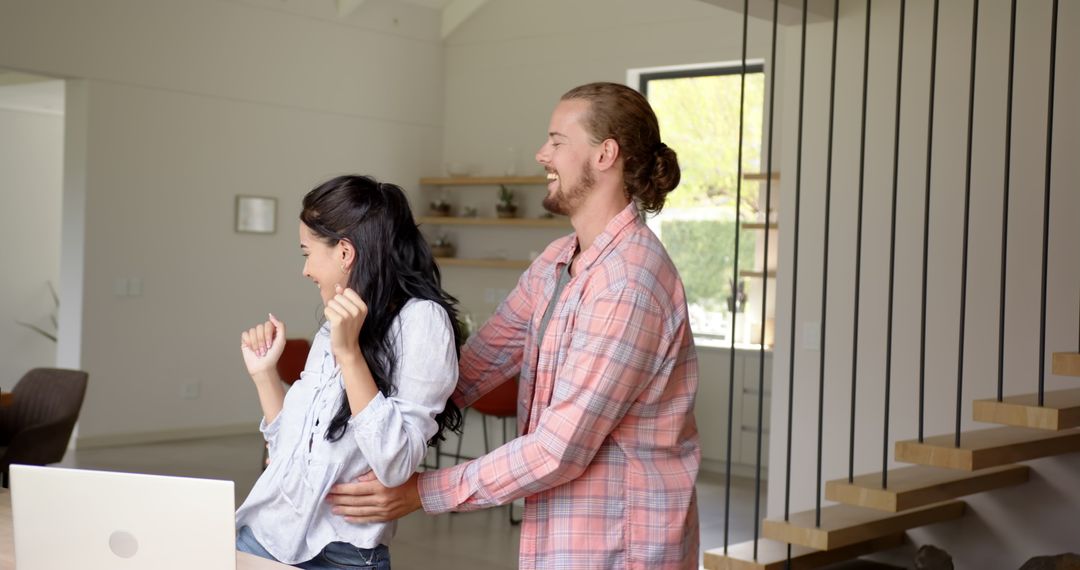 Playful Couple Enjoying Happy Moment at Home
