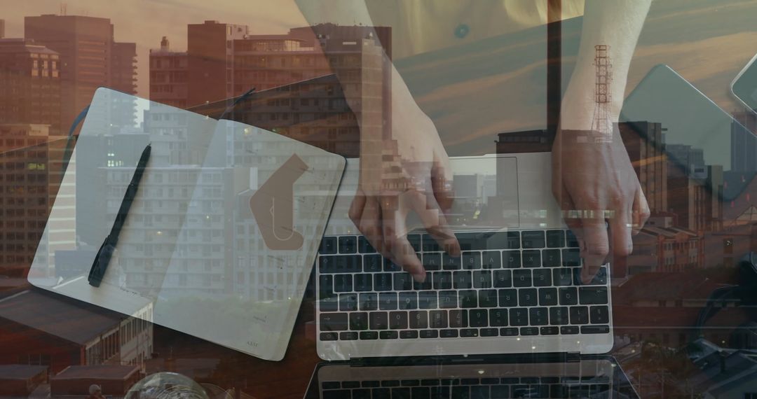 Hands Typing on Laptop with Overlayed Cityscape Background