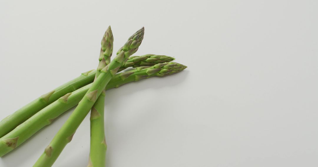 Fresh Green Asparagus on White Background - Free Images, Stock Photos and Pictures on Pikwizard.com