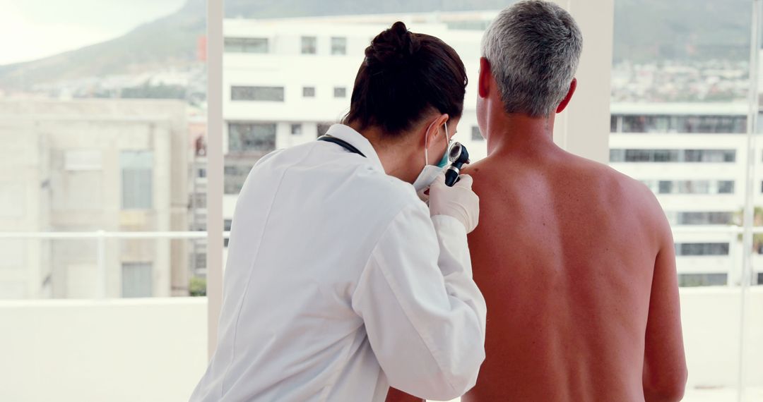 Doctor Examining Patient's Skin During Dermatology Check-Up - Free Images, Stock Photos and Pictures on Pikwizard.com