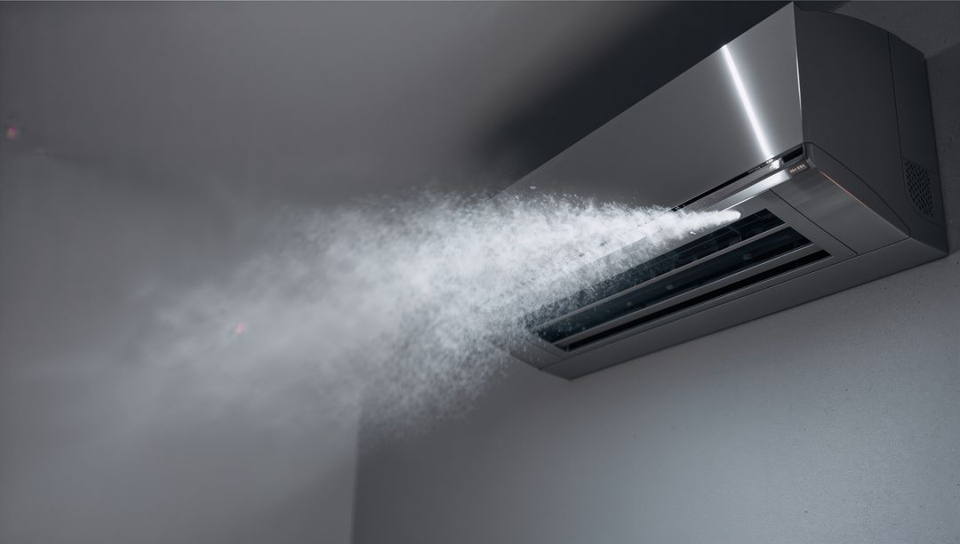 Modern Air Conditioner Emitting Cool Mist in Minimalist Interior