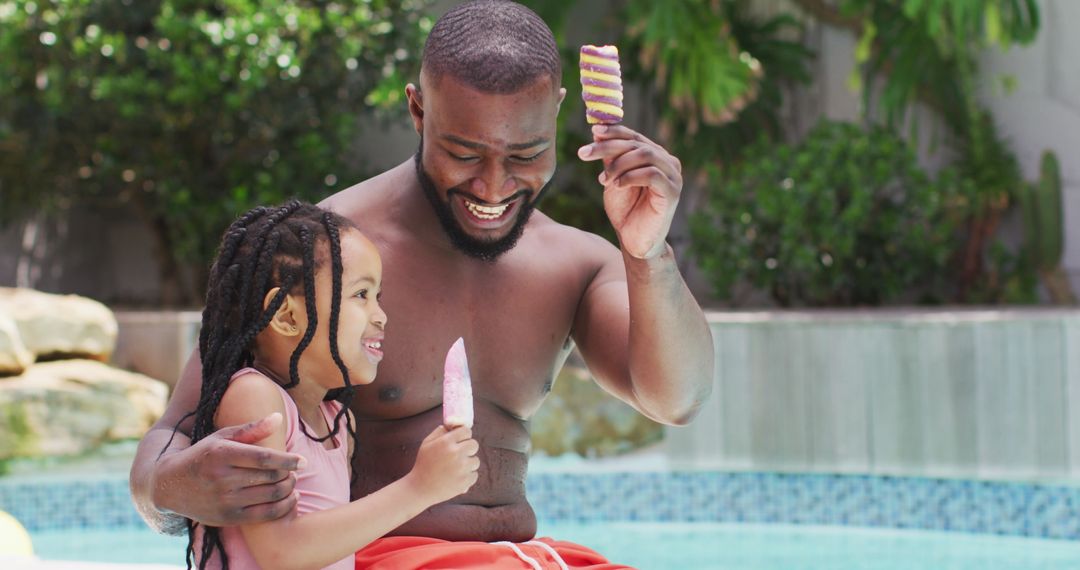 Father and Daughter Enjoying Ice Cream Together by Poolside