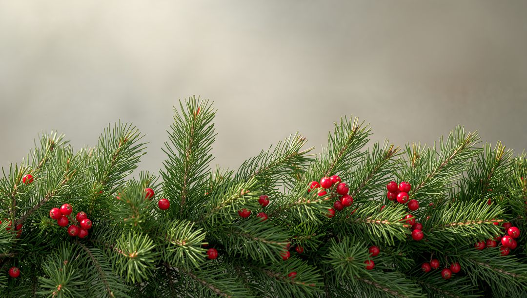 Creating holiday table with evergreen garland and red berry clusters for seasonal decor