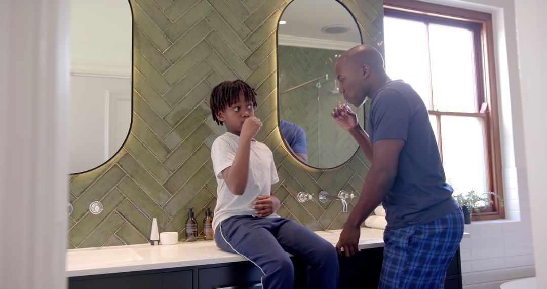 African American Father and Son Brushing Teeth Together at Home, Promoting Family Bonding and Hygien - Free Images, Stock Photos and Pictures on Pikwizard.com