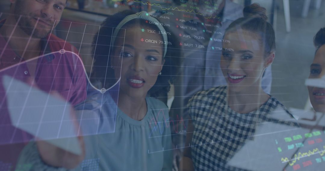 Coworkers Analyzing Digital Financial Data in Office Environment