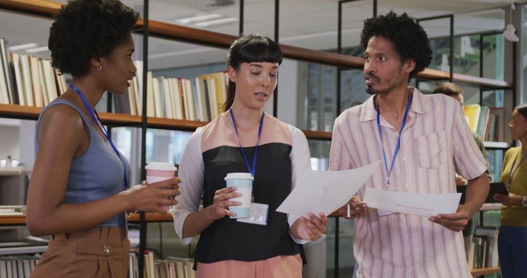 Diverse Business Team Discussing Documents in Modern Office
