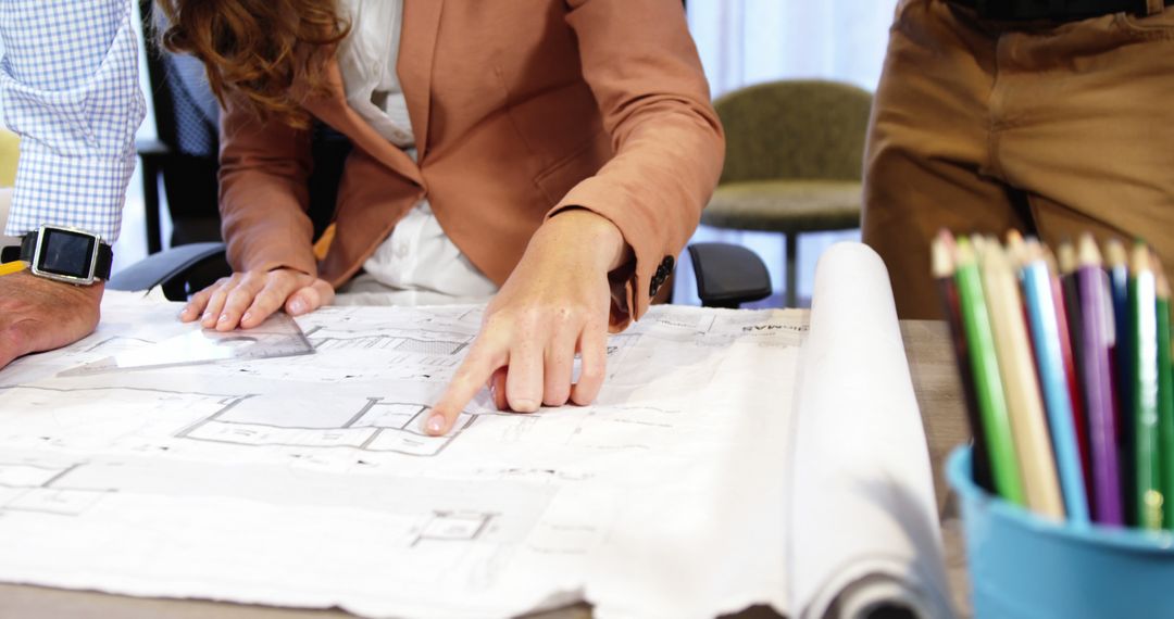 Architects Discussing Blueprints on Desk - Free Images, Stock Photos and Pictures on Pikwizard.com