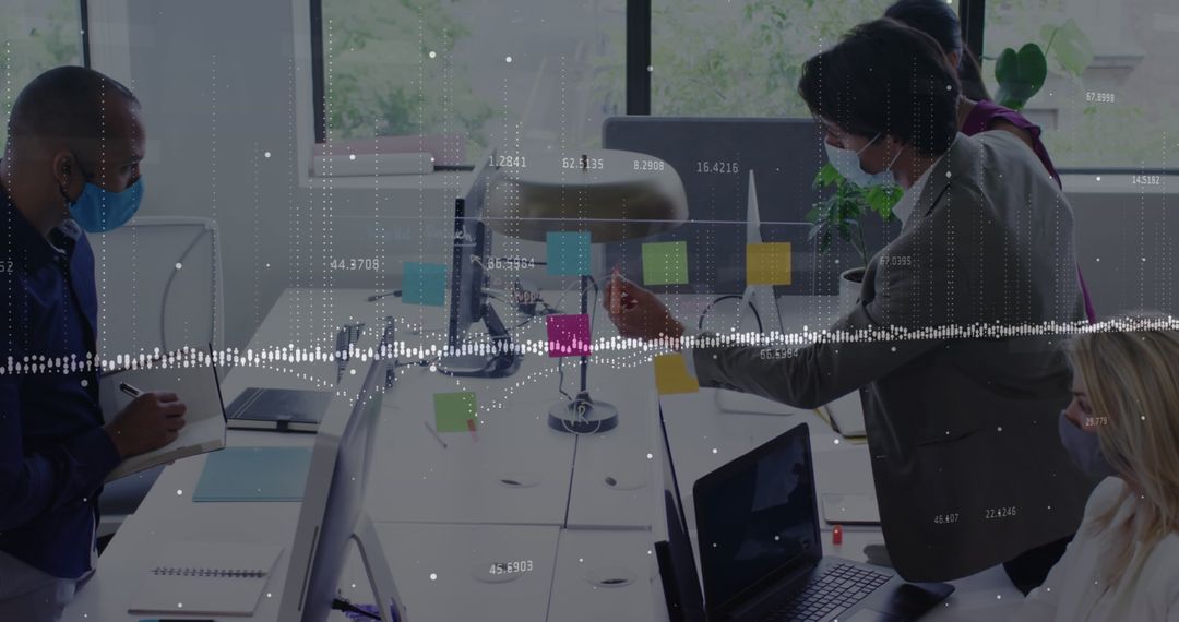 Diverse Team Collaborating in Office with Data Analytics Overlay