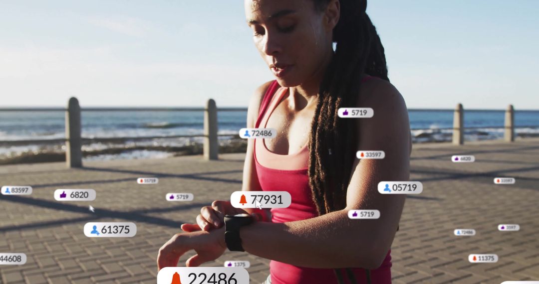 Jogger Adjusting Fitness Tracker during Seaside Workout