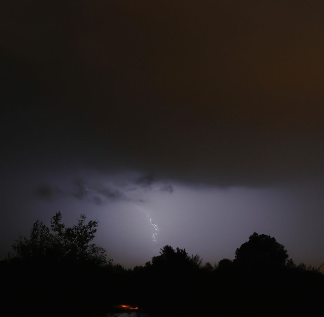 Dark Thunderstorm Night with Lightning in the Distance - Free Images, Stock Photos and Pictures on Pikwizard.com
