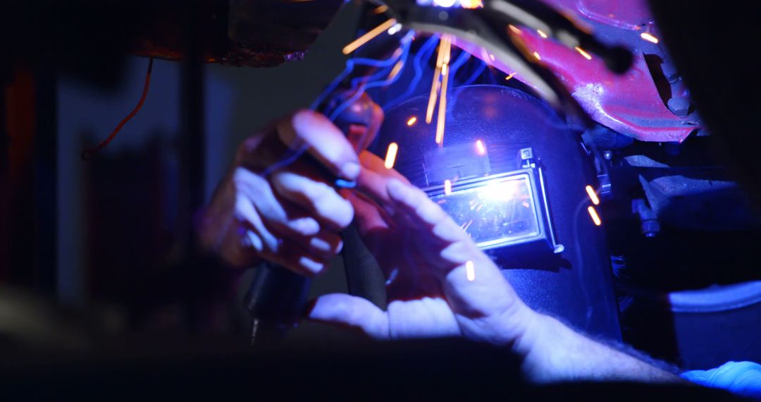 Skilled Welder Crafting with Sparks in Industrial Workshop - Free Images, Stock Photos and Pictures on Pikwizard.com