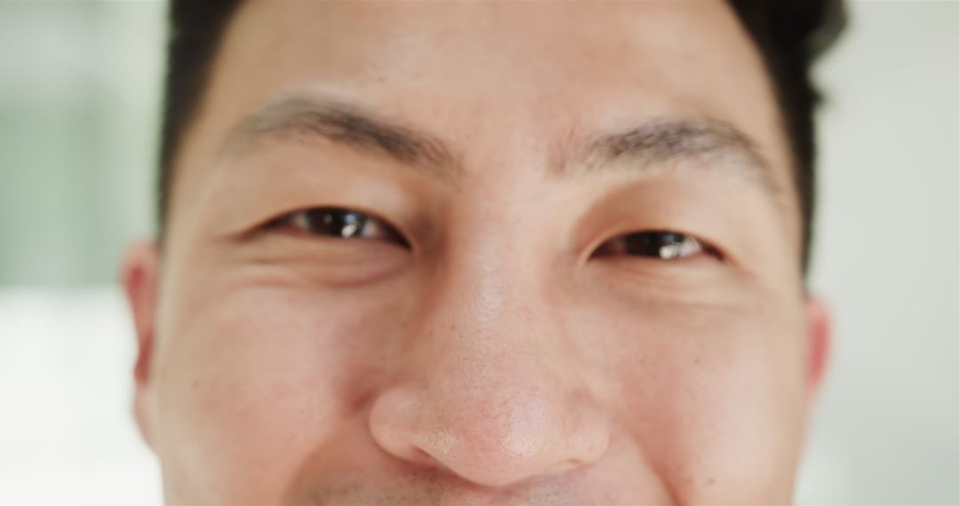 Close-up of Smiling Asian Man, Capturing Joyful Expression
