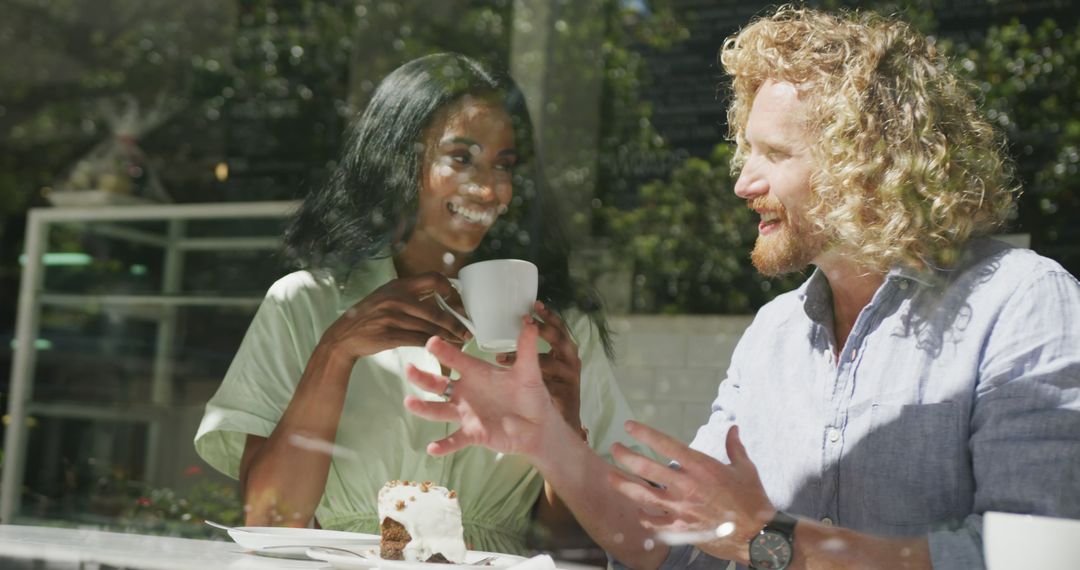 Smiling couple enjoying coffee and cake in outdoor cafe - Free Images, Stock Photos and Pictures on Pikwizard.com