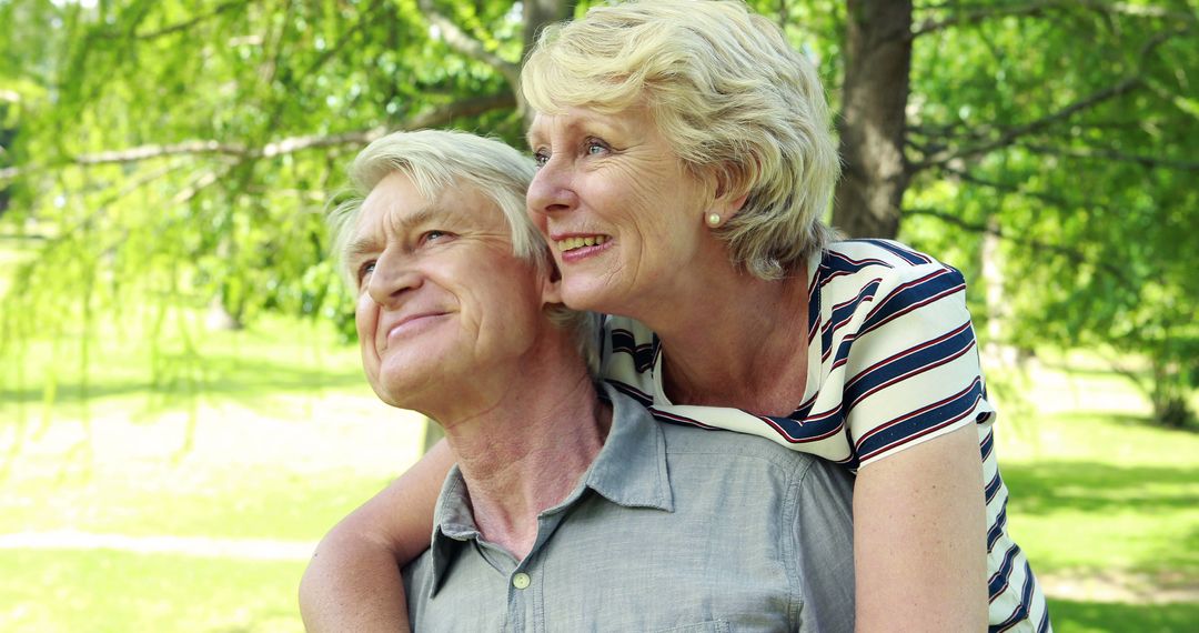 Senior Couple Enjoying a Sunlit Park Outing