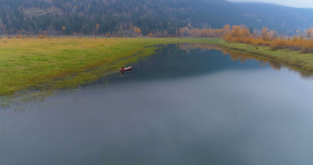 Tranquil Kayaking on Serene Mountain Lake in Autumn - Free Images, Stock Photos and Pictures on Pikwizard.com