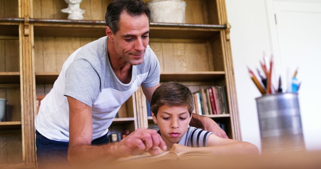 Father Helping Son with Homework in Cozy Room - Free Images, Stock Photos and Pictures on Pikwizard.com