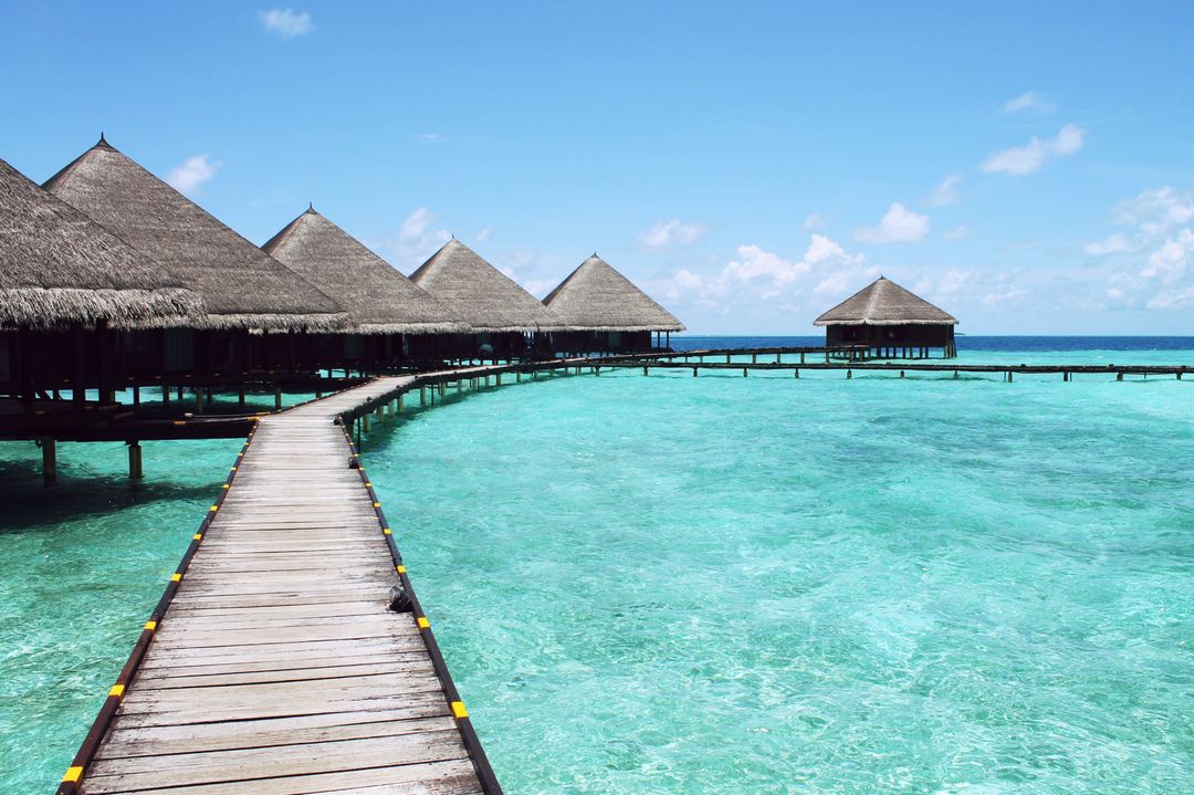 Idyllic Overwater Bungalows with Clear Turquoise Sea and Wooden Walkway - Free Images, Stock Photos and Pictures on Pikwizard.com