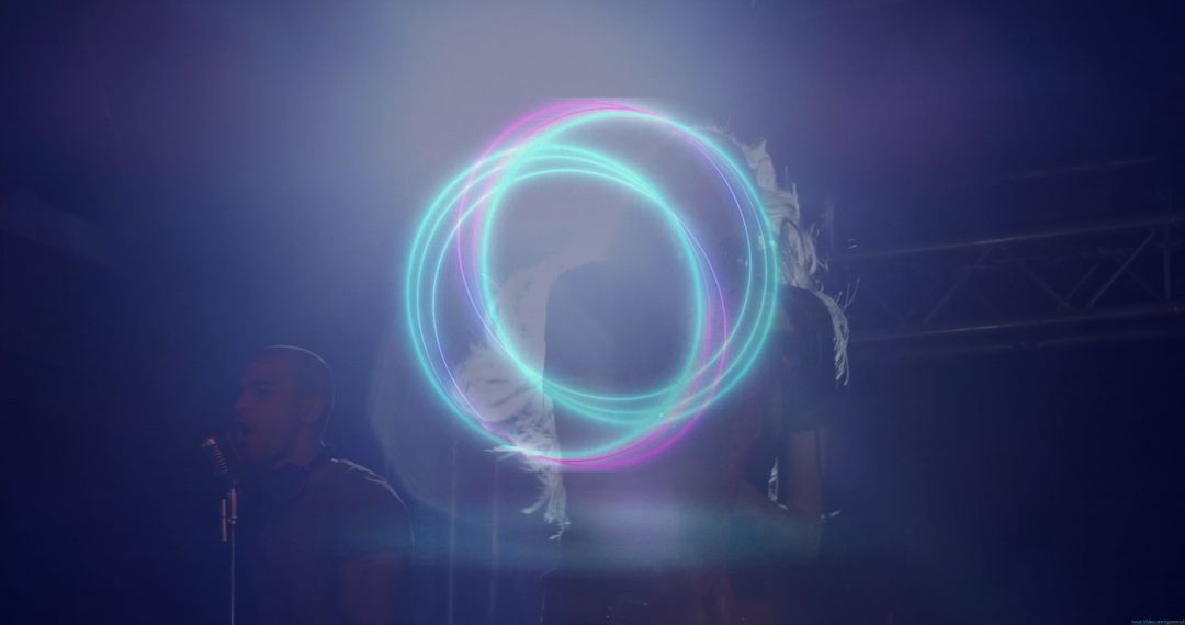 Musicians Performing Live on Stage with Neon Circle Lighting