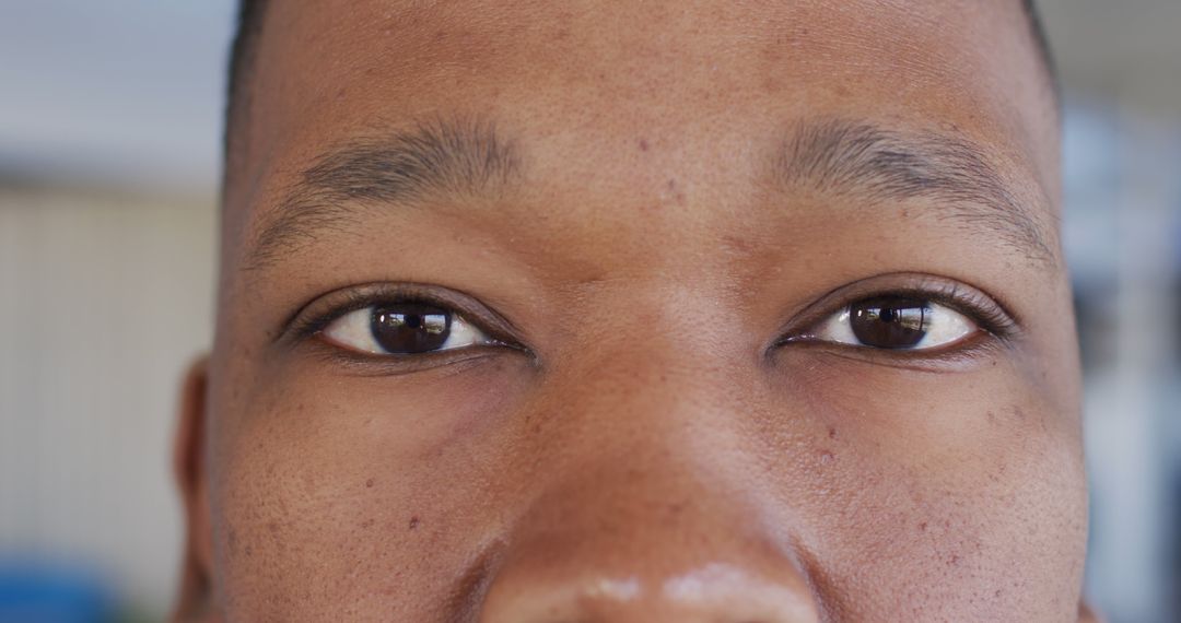 Close-Up of Brown Eyes of Young African American Man - Free Images, Stock Photos and Pictures on Pikwizard.com