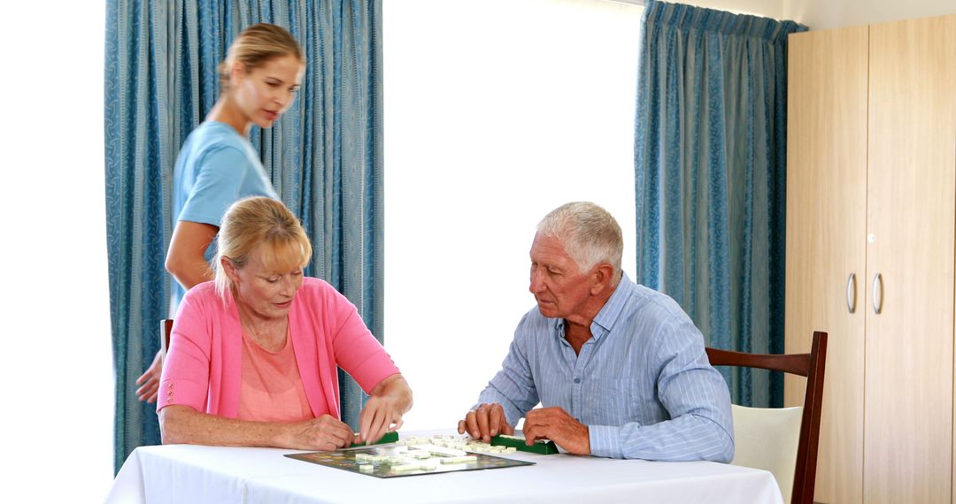 Senior Couple Solving Puzzle with Caregiver Support