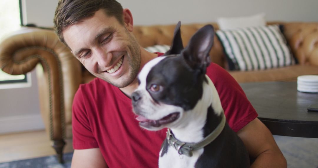 Man Enjoying Leisure Time with Pet Dog at Home