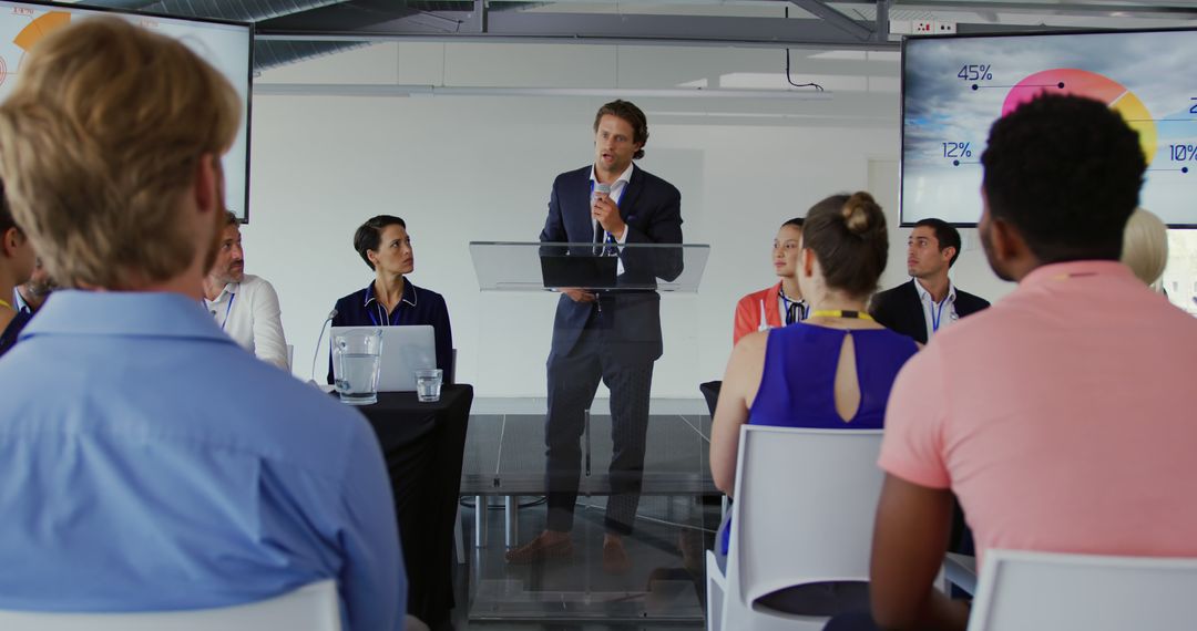 Business Presentation by Confident Speaker in Modern Conference Room - Free Images, Stock Photos and Pictures on Pikwizard.com