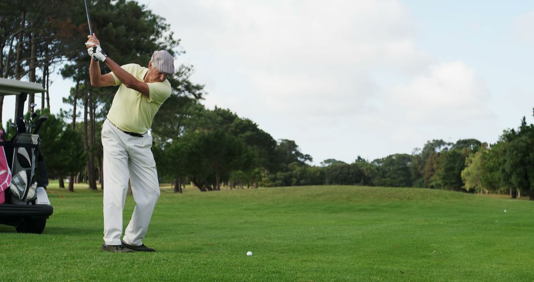 Senior Man Playing Golf on a Sunny Day - Free Images, Stock Photos and Pictures on Pikwizard.com