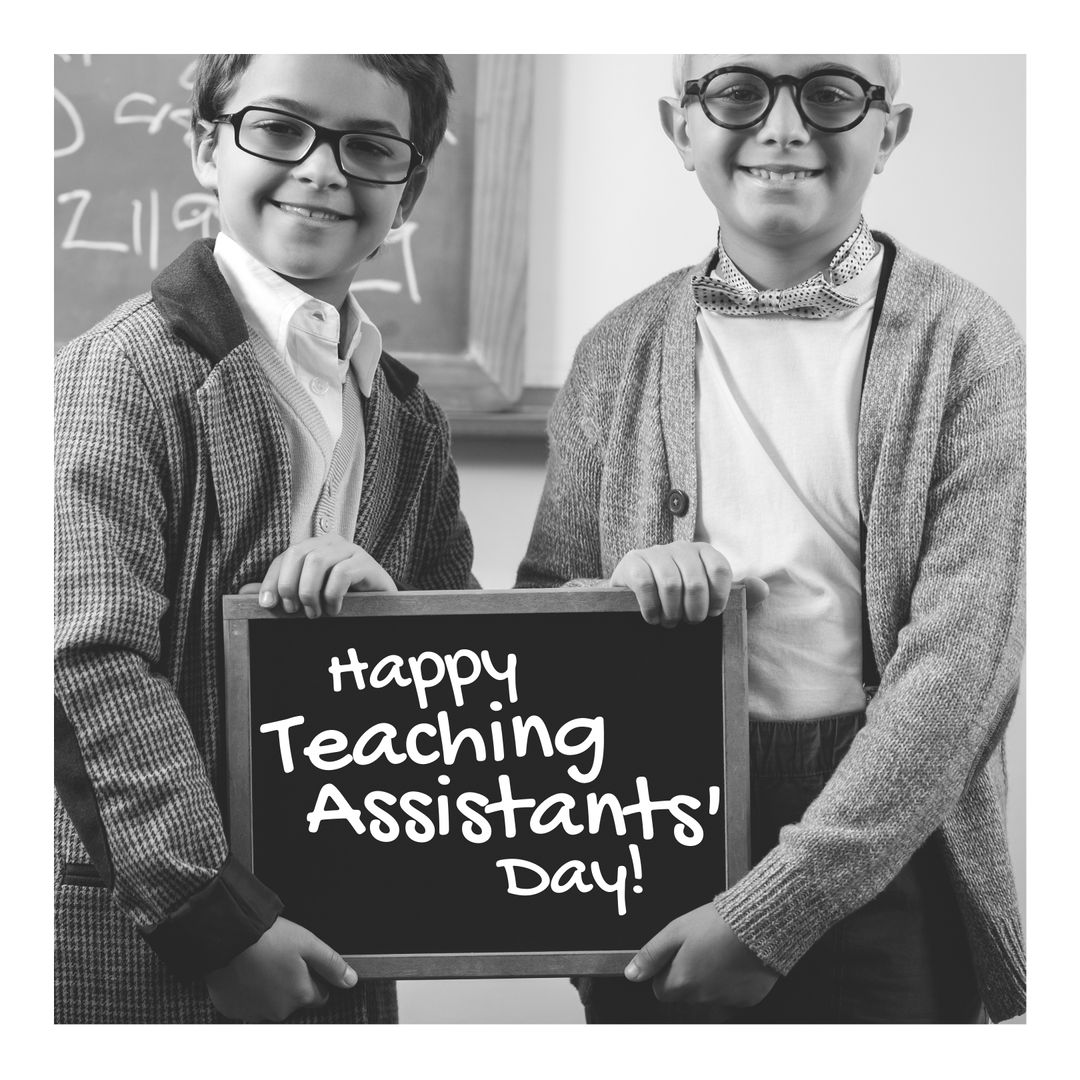 Happy Teaching Assistants' Day with Smiling Boys Holding Blackboard