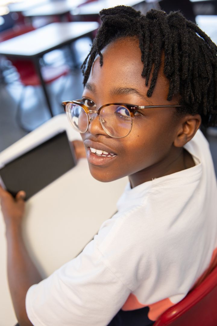 Student Engaging with Tablet in Classroom Setting