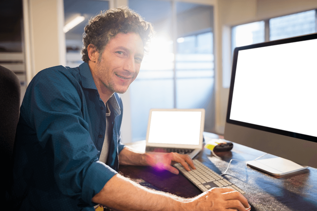 Transparent Smiling Businessman at Desk With Digital Devices