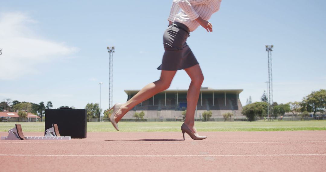 Businesswoman Running on Track in Heels with Buildings in Background - Free Images, Stock Photos and Pictures on Pikwizard.com