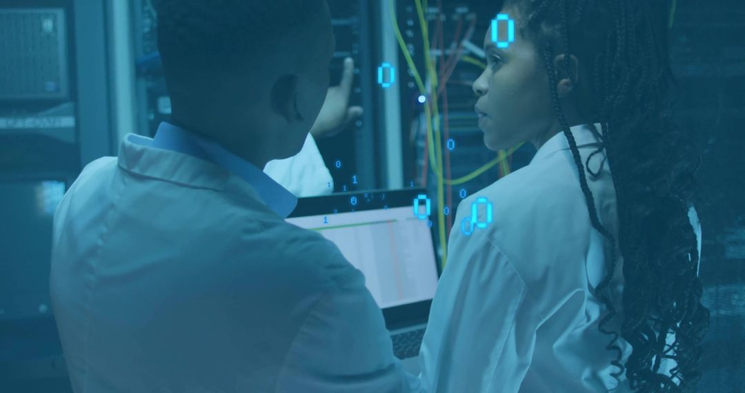 IT Technicians Analyzing Server Data in Modern Data Center Environment