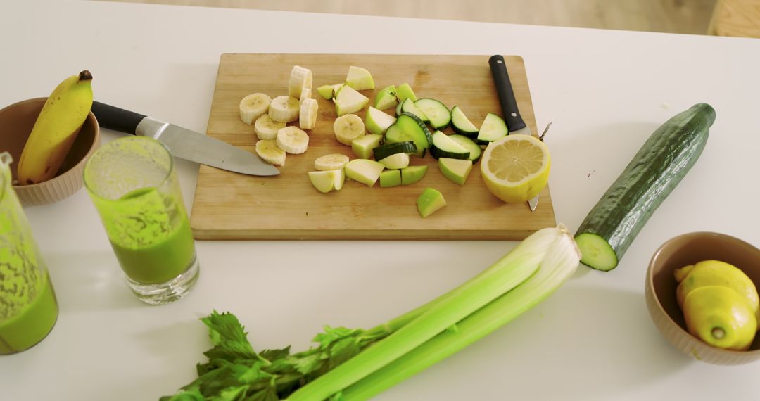 Fresh Produce Preparation with Green Smoothie and Cutlery