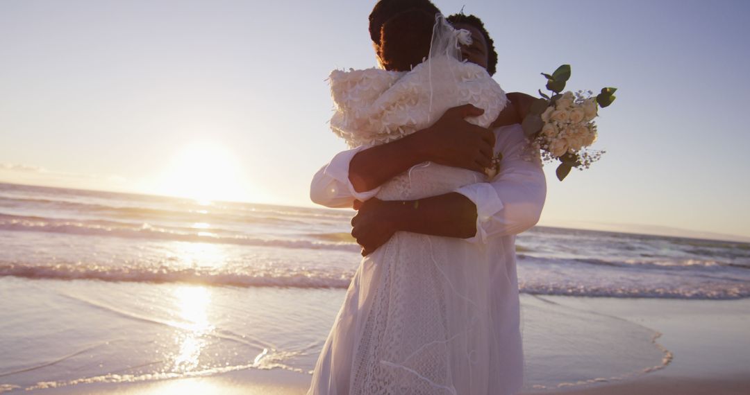 African american couple in love getting married, embracing on the beach at sunset - Free Images, Stock Photos and Pictures on Pikwizard.com