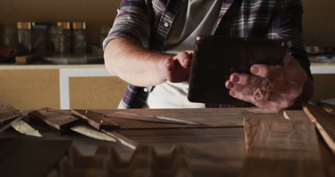 Carpenter Using Tablet in Workshop for Woodworking Projects - Free Images, Stock Photos and Pictures on Pikwizard.com