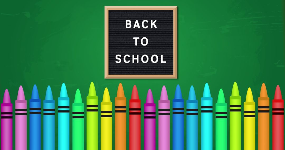 Colorful crayons with back to school board on green chalkboard